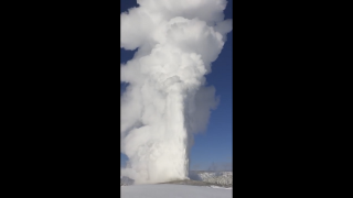 Old Faithful Erupts Snow in Frigid Temperatures at Yellowstone