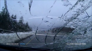 Big Rig Unintentionally Launches Frozen Snow Into Passing Car's Windshield