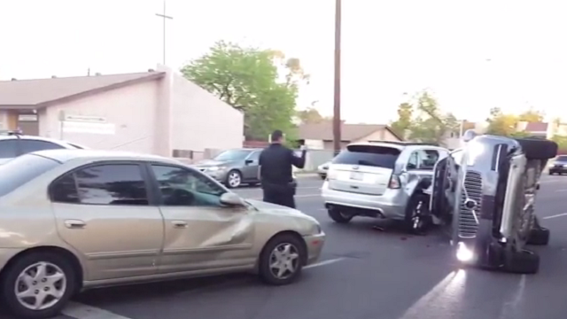 Self-Driving Uber Car Flips On Side In Arizona Accident